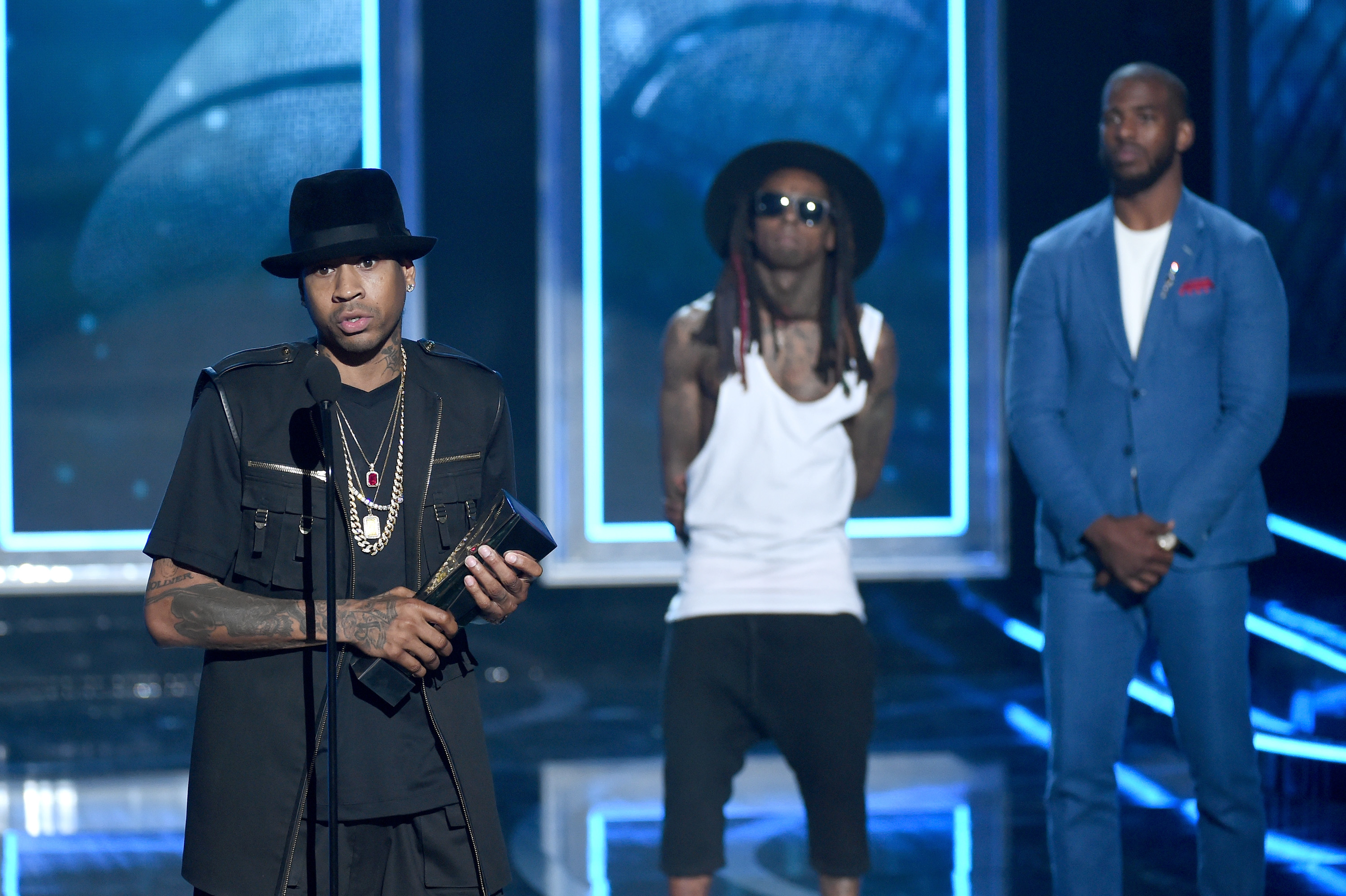 LAS VEGAS, NV - JULY 19: (L-R) Retired NBA player Allen Iverson accepts the Game Changer Award from Rapper Lil Wayne and NBA player Chris Paul of the Los Angeles Clippers speak onstage during The Players' Awards presented by BET at the Rio Hotel & Casino on July 19, 2015 in Las Vegas, Nevada. (Photo by Ethan Miller/BET/Getty Images for BET)